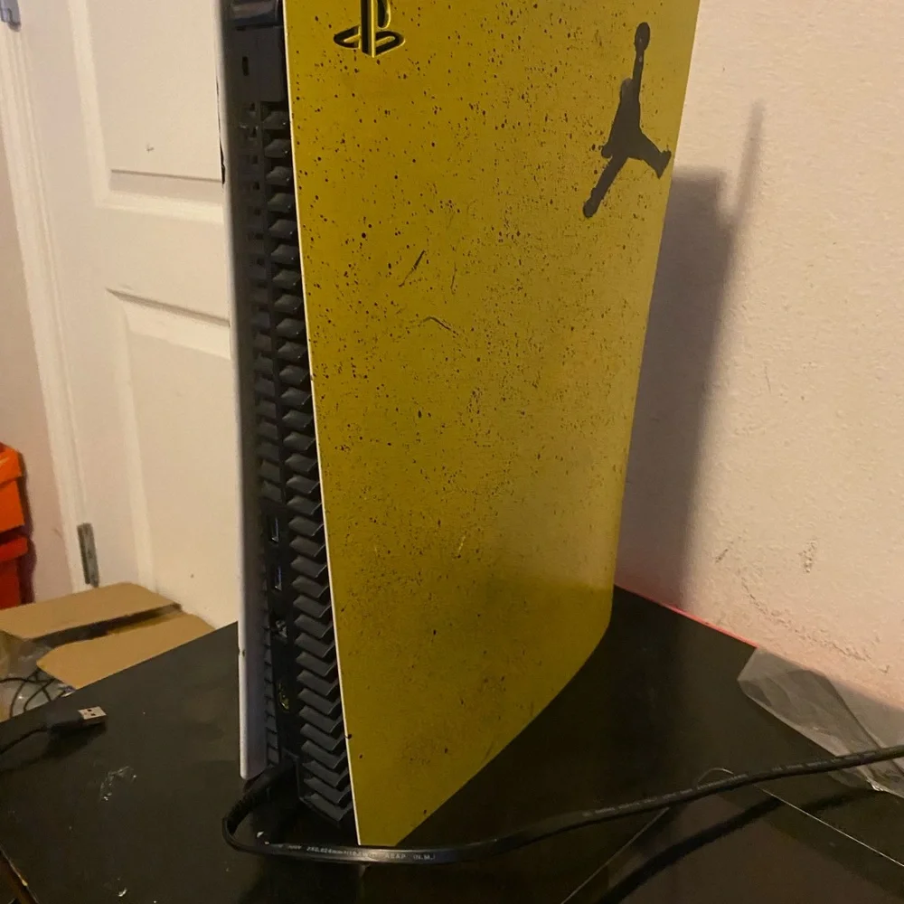 Yellow PlayStation Console with Jordan Logo
